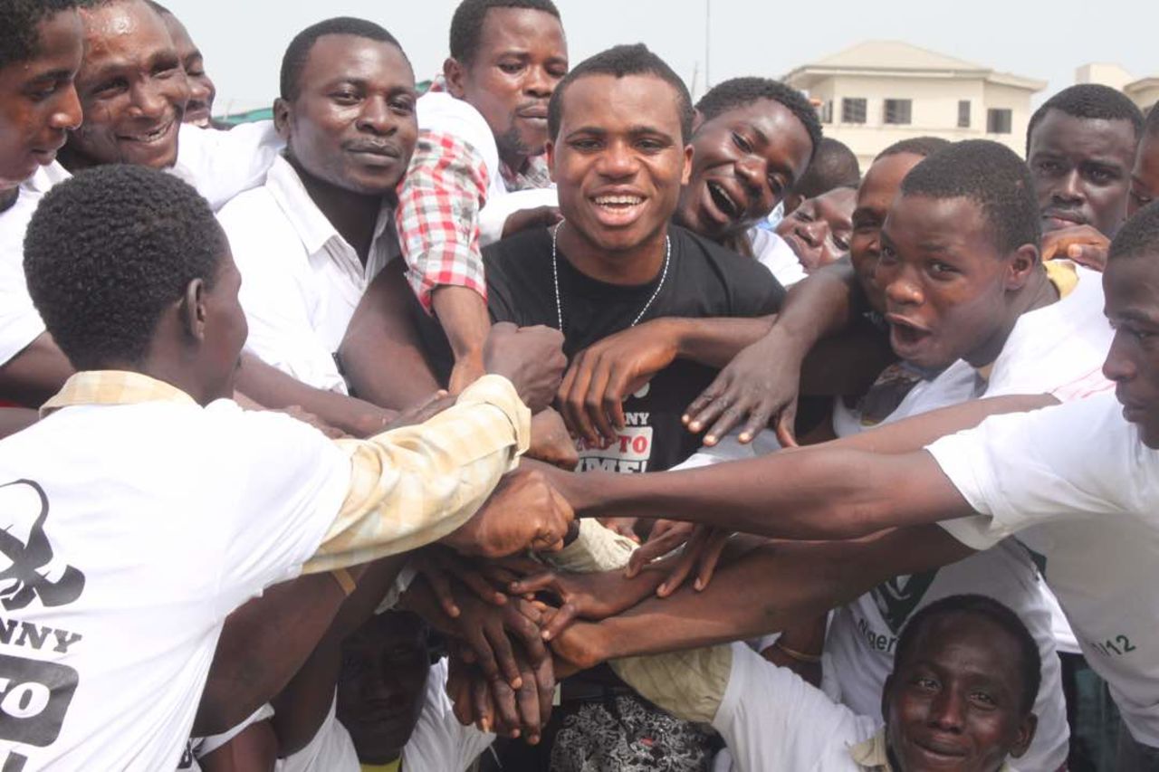 Lamboginny with some prisoners he helped to get released after a prison concert in Ikoyi Prison, Lagos in 2012.