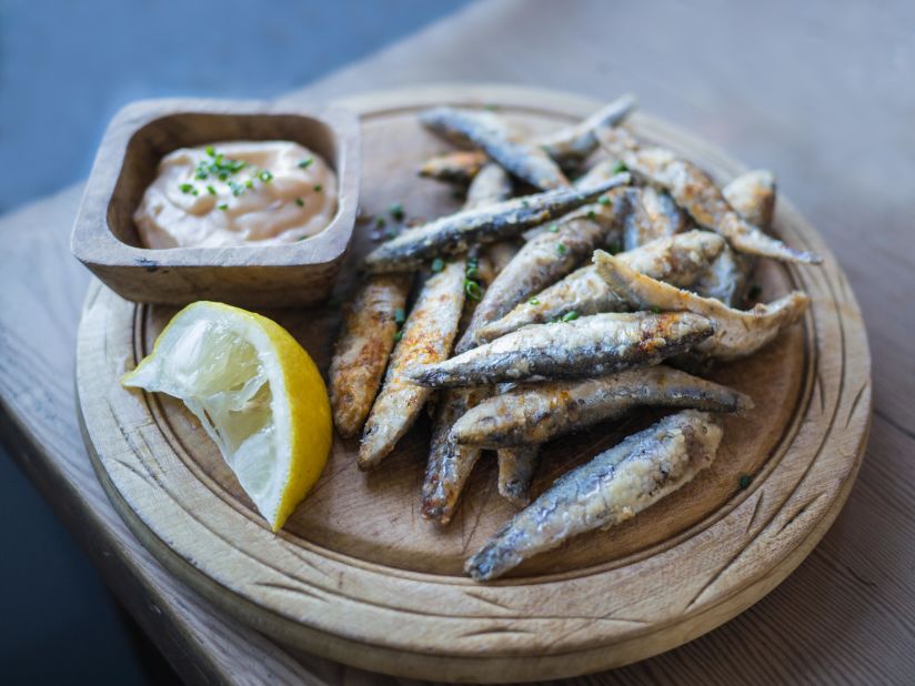 Whitebait on a board -- rustic chic has overwhelmed haute cuisine.