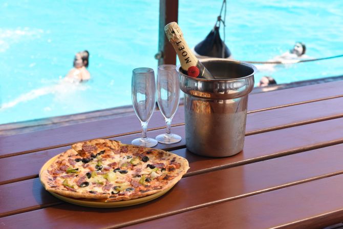 <strong>Lunch is served:</strong> Served on thick wood butchers' boards, thin crust, wood-fired pizza is the order of the day. There are about six options available, including classic Margherita, Hawaiian (topped with ham and pineapple) and a four-cheese white pizza.