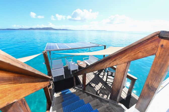 <strong>Going green</strong>: Designed by Fiji-based Australian architect Lisa Philp, the floating restaurant was constructed using three different types of local woods -- mahogany, raintree and treated pine. The structure sits atop two pontoons, while white canvas tarps provide shade. Solar panels power the entire operation. 