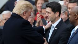 WASHINGTON, DC - DECEMBER 20:  U.S. President Donald Trump (2nd L) congratulates Speaker of the House Paul Ryan (R-WI) (C) during an event to celebrate Congress passing the Tax Cuts and Jobs Act with Senate Majority Leader Mitch McConnell (R-KY) (L) and other Republican members of the House and Senate on the South Lawn of the White House December 20, 2017 in Washington, DC. The tax bill is the first major legislative victory for the GOP-controlled Congress and Trump since he took office almost one year ago.  (Photo by Chip Somodevilla/Getty Images)