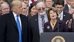 Senator Lisa Murkowski, a Republican from Alaska, speaks during a tax bill passage event with U.S. President Donald Trump, second left, and Republican congressional members of the House and Senate on the South Lawn of the White House in Washington, D.C., U.S., on Wednesday, Dec. 20, 2017. House Republicans passed the most extensive rewrite of the U.S. tax code in more than 30 years, hours after the Senate passed the legislation, handing Trump his first major legislative victory. Photographer: Andrew Harrer/Bloomberg via Getty Images