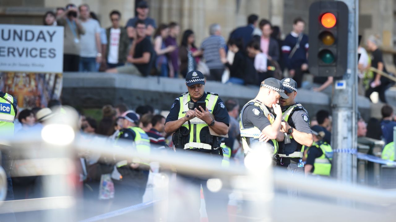 Police and emergency personnel work at the scene of where a car ran over pedestrians in Flinders Street in Melbourne on December 21, 2017.