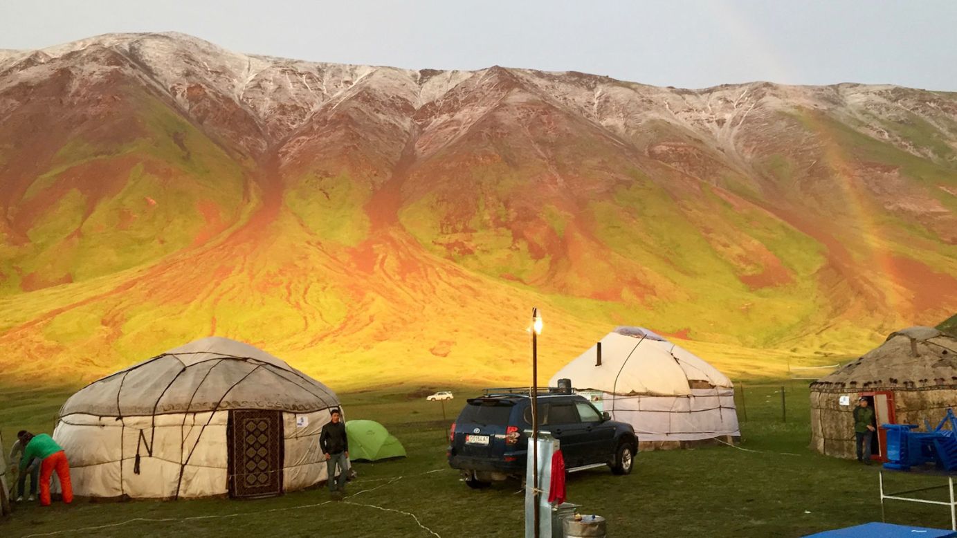 <strong>Rainbow-colored landscape: </strong>Guests weathered a quick but fierce hailstorm in yurts on festival grounds, getting to know each other over a few beers. After the hailstorm subsided, revelers emerged from the tents to this scene. The mountains were an absolutely electric array of colors, almost as bright and crisp as the colors of the simultaneous double rainbows, says Sherr.
