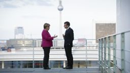 BERLIN, GERMANY - MAY 15:  In this handout photo provided by the German Government Press Office (BPA), German Chancellor Angela Merkel talks with newly-elected French President Emmanuel Macron on the terrace, with a view of the television tower in the background during his visit to the chancellor's office on May 15, 2017 in Berlin, Germany. Macron is visiting Berlin only a day after being sworn in as president in Paris. While Macron and Merkel have both demonstrated an unwavering commitment to the European Union and Merkel strongly applauded Macron's election, they are likely to differ over Macron's desire for E.U.-issued bonds, a measure Merkel has strongly opposed in the past.  (Photo by Guido Bergmann/Bundesregierung via Getty Images)
