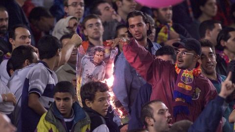Barca players burn a picture of Luis Figo after he controversially moved to Real for a then world-record fee in 2000