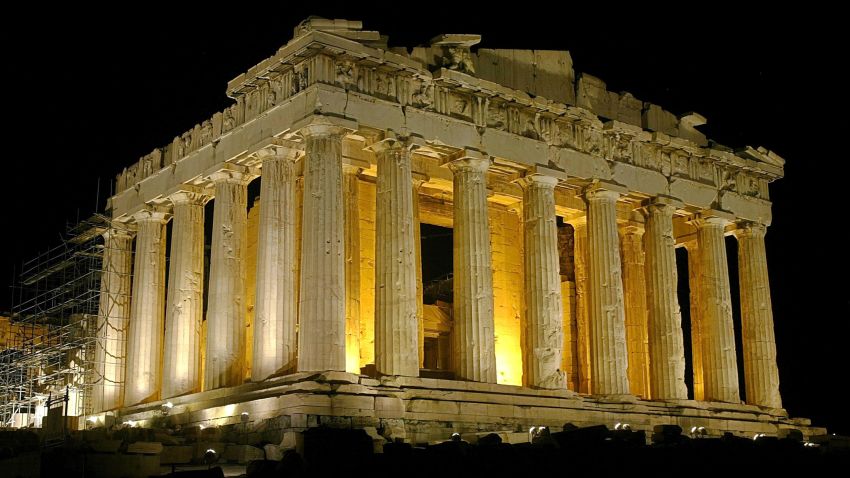 ATHENS - AUGUST 26:  The temple of Parthenon is pictured lit up at night atop the ancient Acropolis of Athens on August 26, during the 2004 Olympic Games in Athens, Greece. (Photo by Milos Bicanski/Getty Images)