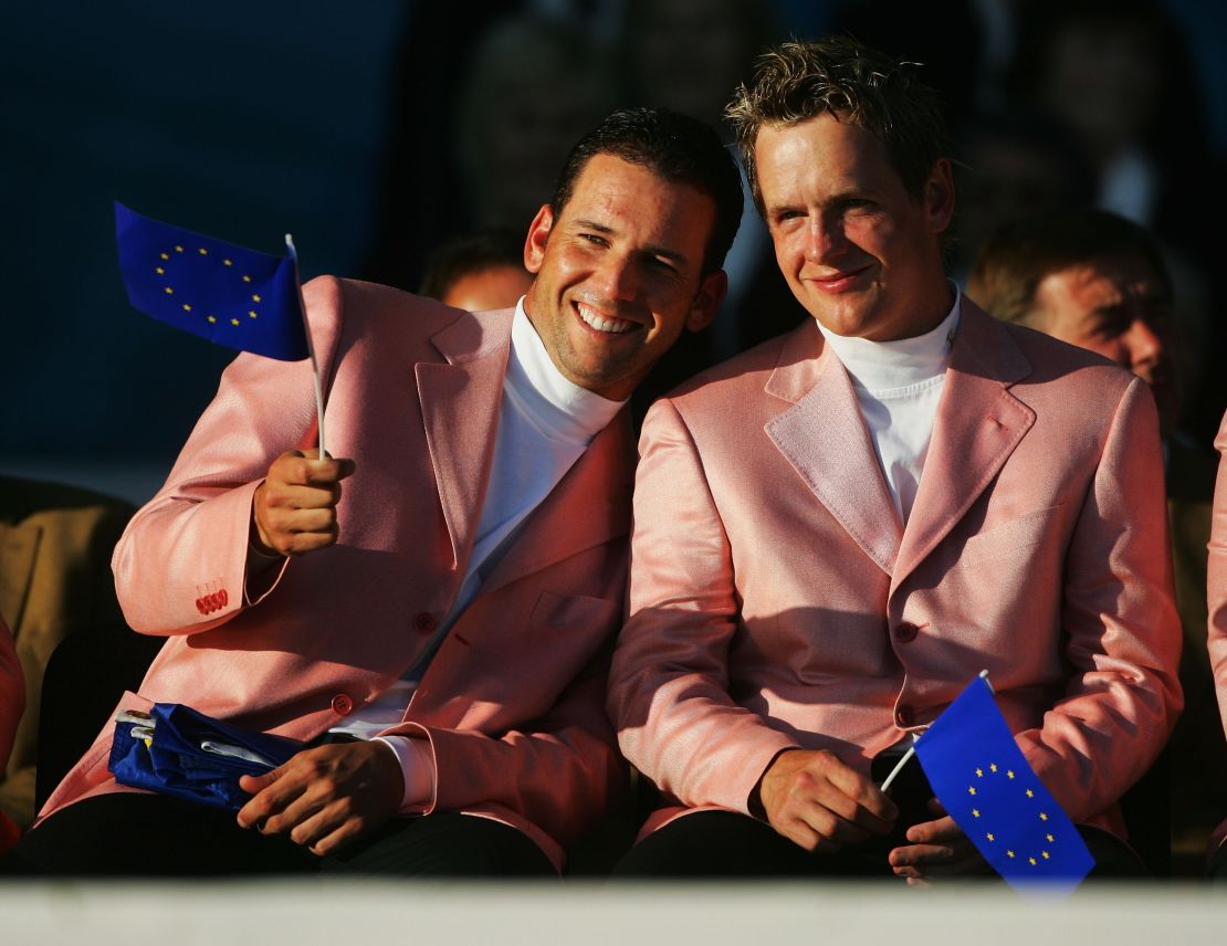 Sergio Garcia (L) and Luke Donald wave European flags at 2006 closing ceremony