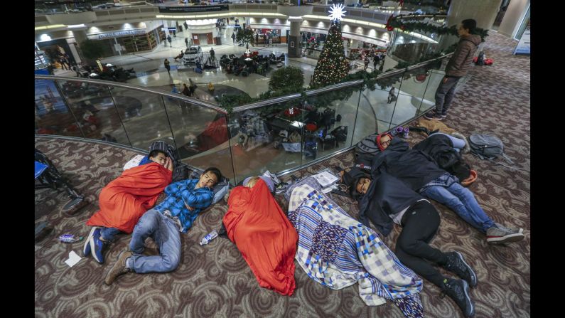 Travelers sleep at Hartsfield-Jackson International Airport in Atlanta on Monday, December 18, the day after a <a href="http://www.cnn.com/2017/12/18/us/atlanta-airport-power-outage/index.html" target="_blank">massive power outage</a> brought operations to a halt. The outage, which affected all airport operations, started with a fire in a Georgia Power underground electrical facility, Mayor Kasim Reed said. An estimated 30,000 people were affected.