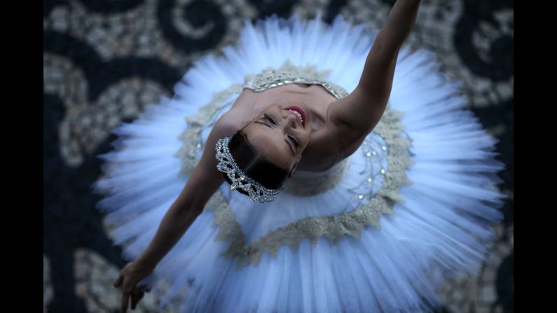Ballet dancer Deborah Ribeiro performs during a protest demanding pay for the employees of Rio de Janeiro's Municipal Theatre in Rio de Janeiro on Monday, December 18. 