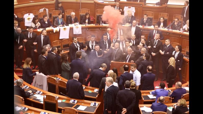 Opposition lawmakers set off smoke bombs in Parliament during a vote for the new temporary general prosecutor in Tirana, Albania, on Monday, December 18.