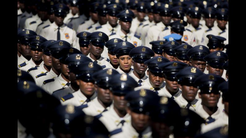 New members of the National Police parade during their graduation ceremony from the Police Academy in Port-au-Prince, Haiti, on Monday, December 18.