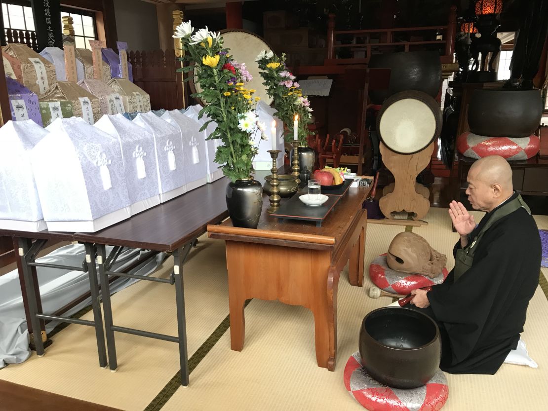 Ryosen Kojima, a priest at Tousenji Temple, says prayers for the recently deceased, including 15 North Koreans who died on fishing boats that washed up on the Oga Peninsula. 