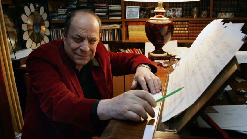 Paris, FRANCE: French composer Charles Dumont poses next one of his music score, 13 February 2007 in Paris. One of the most famous songs of the 20th century -- "Non, Je Ne Regrette Rien" -- might never have been recorded, had the ailing Edith Piaf not woken from her sleep one day in 1960 to overhear a conversation at her front door. "Her secretary told us she was very ill -- that she couldn't receive anyone," recalls composer Charles Dumont, 77, who with lyricist Michel Vaucaire had just written the celebrated French anthem to human resilience. "La Mome" (The Kid), a biopic which is released this week in France amidst a resurgence of interest in Edith Piaf, one of the country's best-loved performers. AFP PHOTO PIERRE VERDY (Photo credit should read PIERRE VERDY/AFP/Getty Images)