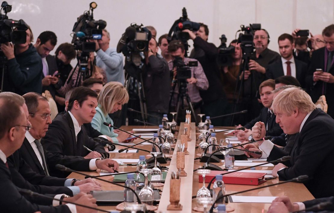Russian Foreign Minister Sergei Lavrov, second left, and UK Foreign Secretary Boris Johnson, right, take part in talks Friday in Moscow.