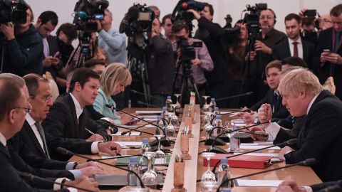 Russian Foreign Minister Sergei Lavrov, second left, and UK Foreign Secretary Boris Johnson, right, take part in talks Friday in Moscow.