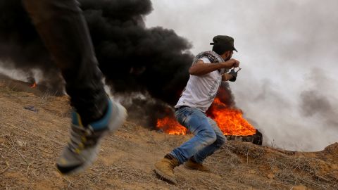 Palestinian protesters clash with Israeli security forces on Friday near the border with Israel in southern Gaza.