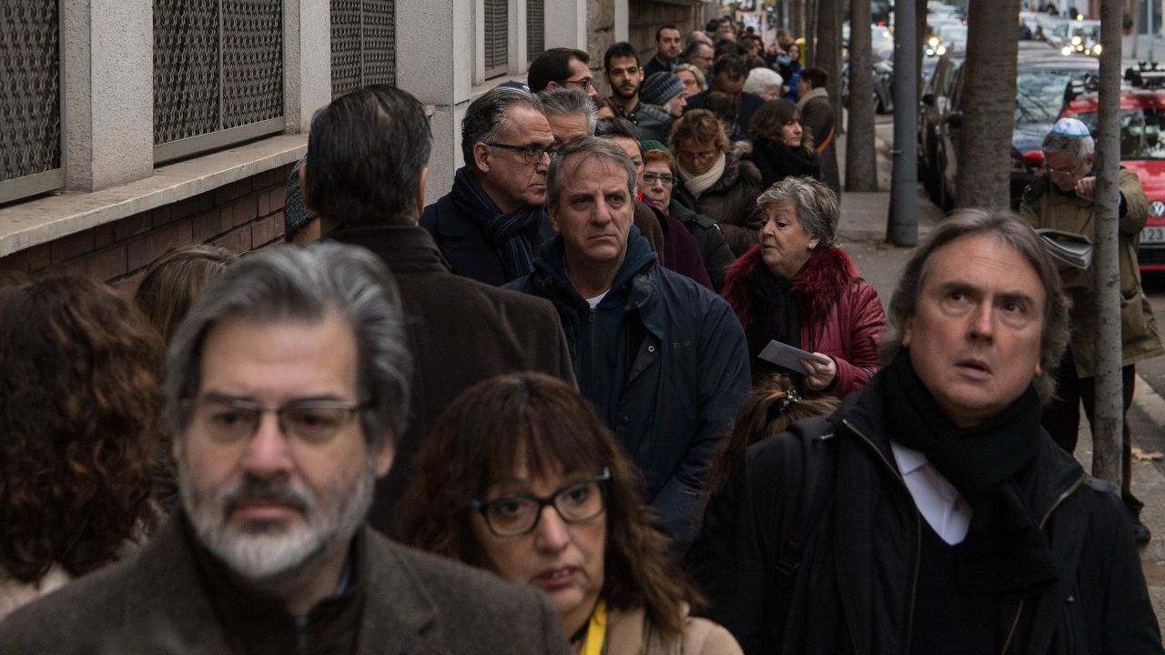 Voters line up outside a polling station in Barcelona, Spain.