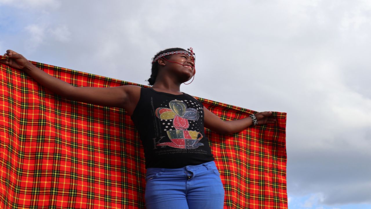 Jane, 15, as photographed by Anita, 15. Anita shared the meaning behind this photo at the community exhibition: "She is displaying her happiness, thinking 'I can now continue with my life!' " (Courtesy Anita/Too Young To Wed)