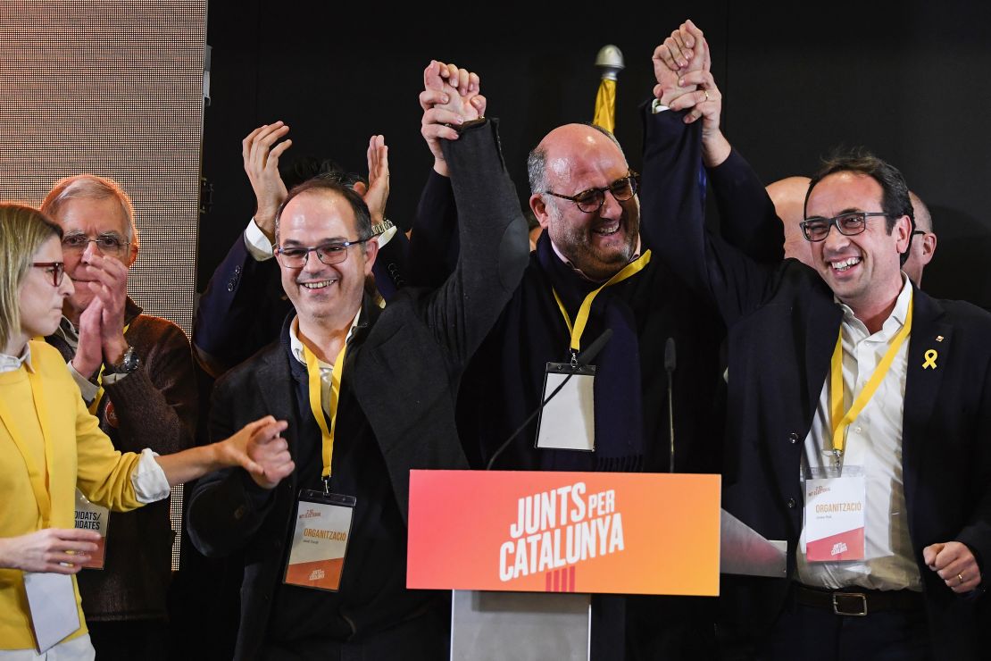 Junts per Catalunya candidates celebrate during a press conference following the Catalan regional election.