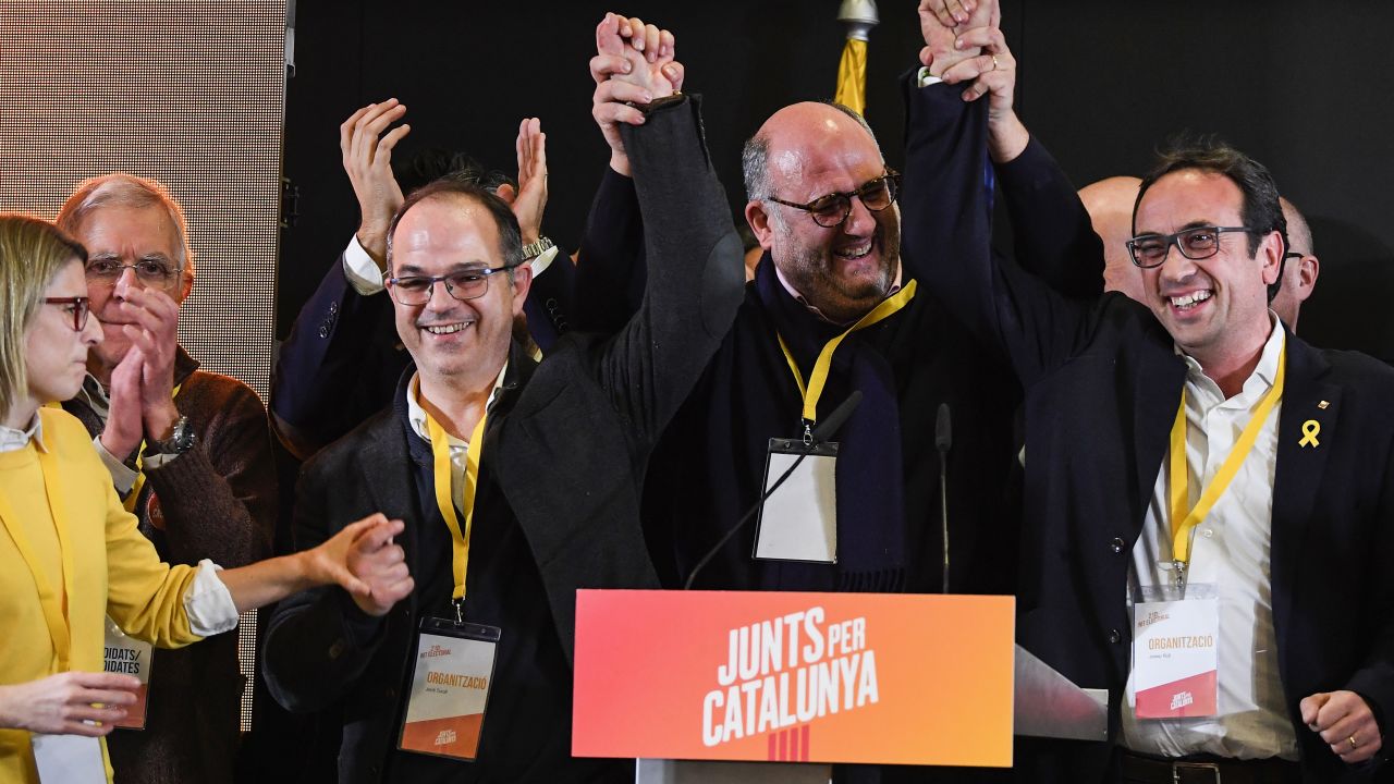 Junts per Catalunya candidates celebrate during a press conference following the Catalan regional election.