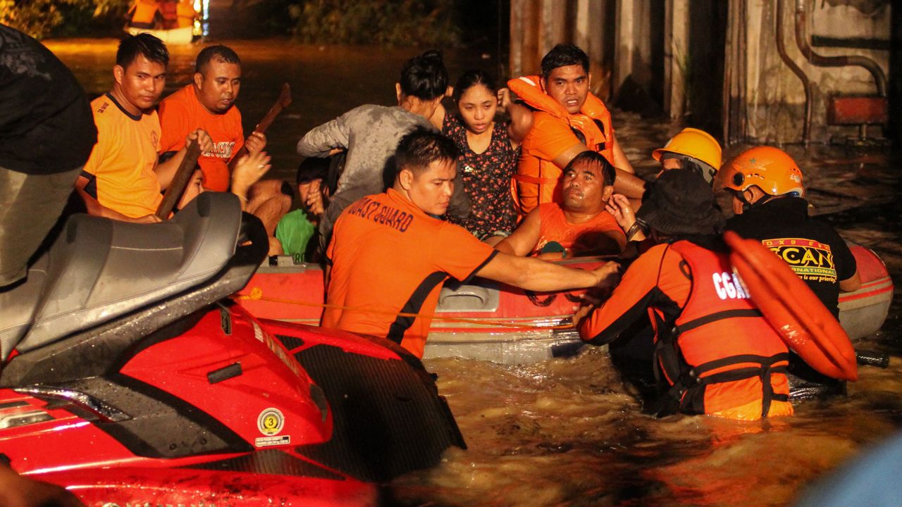 Evacuations are underway in flood-affected areas of Davao on December 23. At least 30,000 people have gone to shelters on the island of Mindanao, an official says.