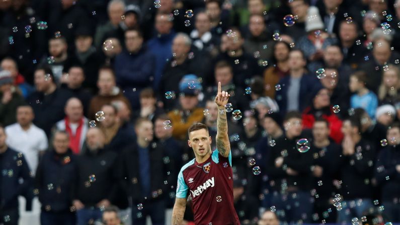 West Ham's Marko Arnautovic celebrates scoring his team's first goal during a Premier League soccer match against Newcastle in London, England, on Saturday, December 23. Newcastle defeated West Ham 3-2.