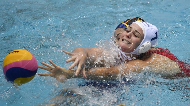 Rebecca Parkes of Hungary vies for the ball with Spain's Matilde Ortiz Reyes during a Water Polo World League match in Budapest, Hungary, on Tuesday, December 19.