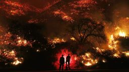 VENTURA, CA - DECEMBER 07:  Firefighters monitor a section of the Thomas Fire along the 101 freeway on December 7, 2017 north of Ventura, California. The firefighters occasionally used a flare device to burn-off brush close to the roadside. Strong Santa Ana winds are rapidly pushing multiple wildfires across the region, expanding across tens of thousands of acres and destroying hundreds of homes and structures.  (Photo by Mario Tama/Getty Images)