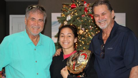 Robinson, left, with MMA Flyweight World Champion Ilima-Lei Macfarlane and his brother.