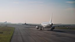 Commercial airplane queue and taxiing on tarmac to take off on runway on a morning
; Shutterstock ID 577160230; Job: -
