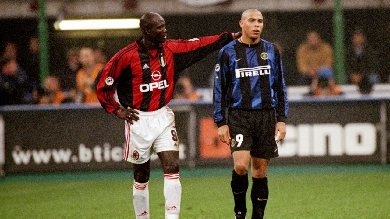 Weah in the red and black of AC Milan consoles Ronaldo of Inter Milan after his sending off during a Serie A match at the San Siro in Milan, Italy.