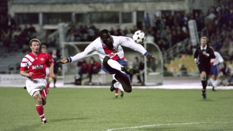 PSG's George Weah kicks the ball during a Champions League match against Spartak Moscow in 1994.