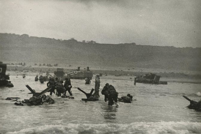 "American soldiers landing on Omaha Beach, D-Day" by Robert Capa (1964).