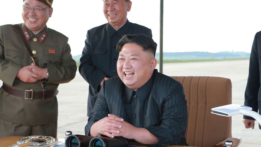 This undated picture released from North Korea's official Korean Central News Agency (KCNA) on September 16, 2017 shows North Korean leader Kim Jong-Un (R) inspecting a launching drill of the medium-and-long range strategic ballistic rocket Hwasong-12 at an undisclosed location.
Kim vowed to complete North Korea's nuclear force despite sanctions, saying the final goal of his country's weapons development is "equilibrium of real force" with the United States, state media reported on September 16.  NK leadership watch says:  Kim Jong Un watches a missile drill on September 15, 2017. Also in attendance behind him are Kim Jong Sik and Ri Pyong Chol (Photo: KCNA).