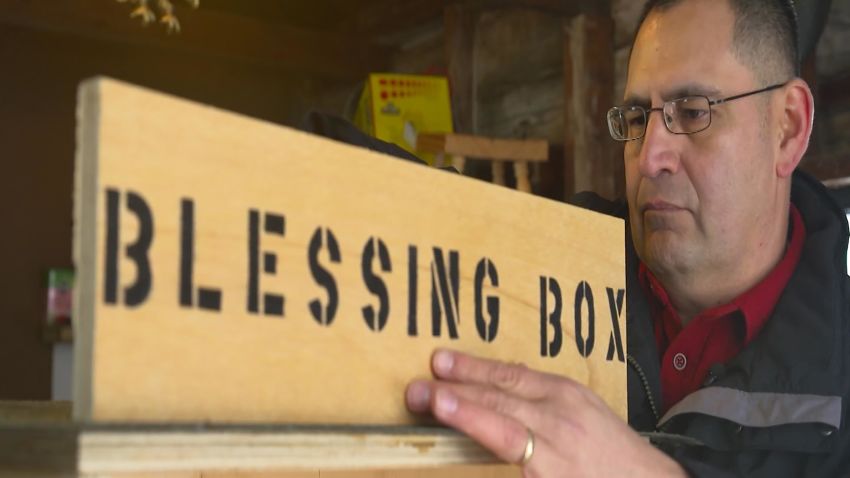 Roman Espinoza assembles a new blessing box in his Watertown, New York workshop.