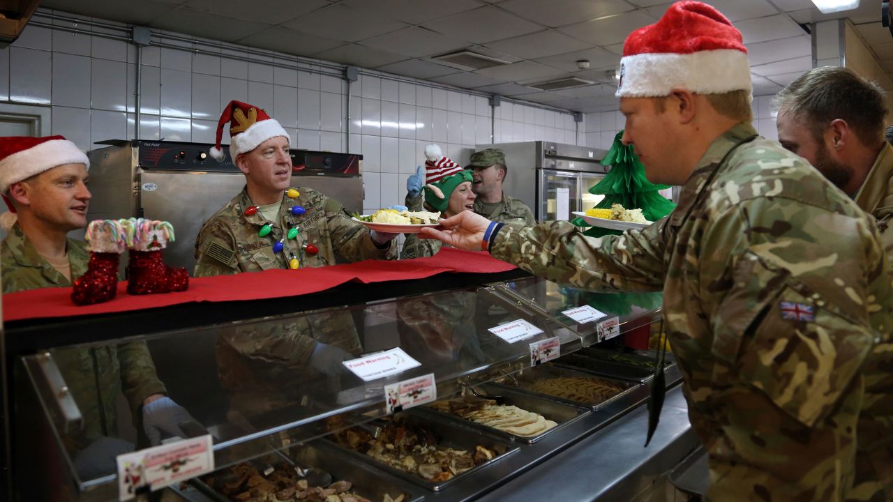 Members of the US military are served dinner on Christmas Day at the Resolute Support Headquarters in Kabul, Afghanistan.
