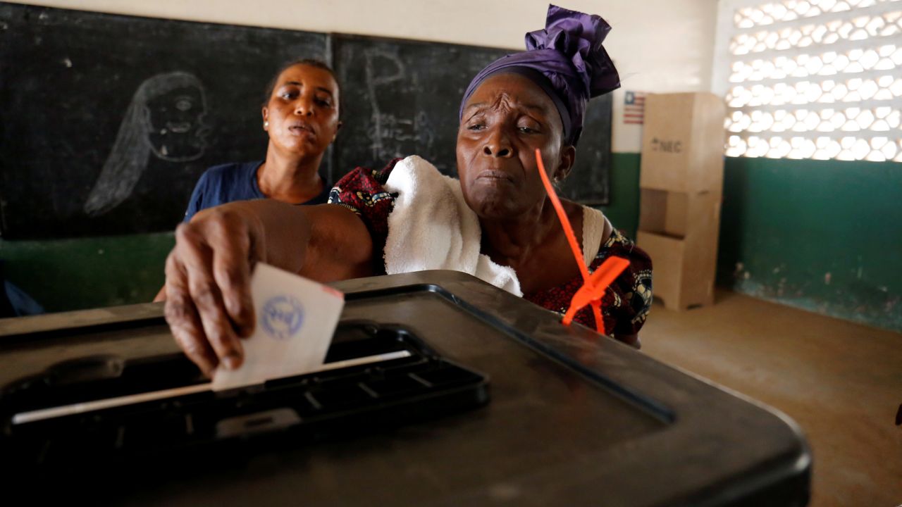 A woman casts her ballot during the presidential election in Monrovia, Liberia, on December 26.
