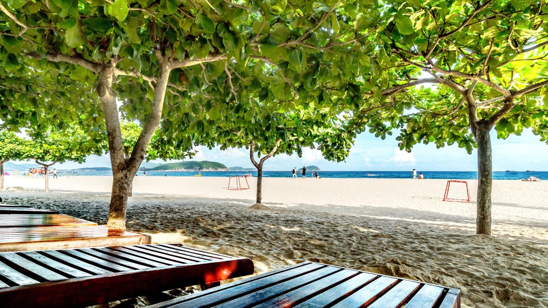 <strong>February in Hainan, China:</strong> Got the winter blues? Beach chairs and trees call your in name Sanya, Hainan. This is the warmest part of China in winter.