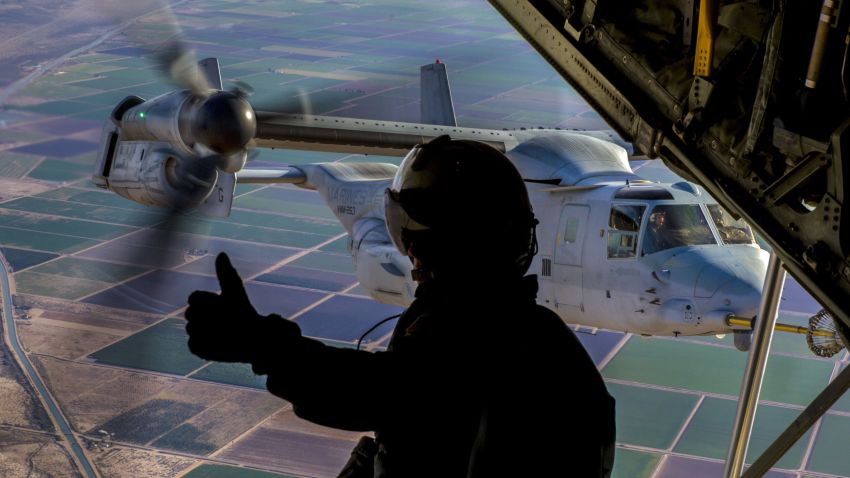 Marine Corps Cpl. Seth Witherup signals to a pilot during training at Naval Air Facility El Centro, Calif., Dec. 6, 2017. Witherup is a crewmaster assigned to Marine Aerial Refueler Transport Squadron 152.
