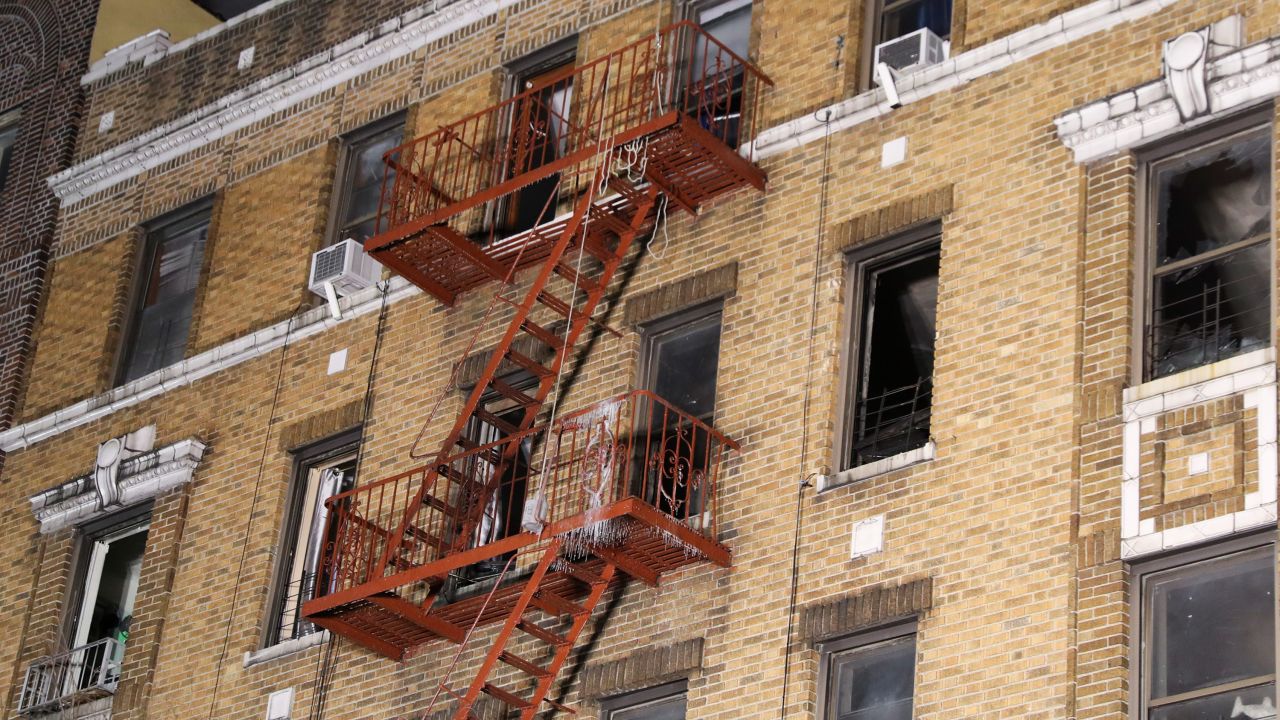 The charred interior and burned-out windows of the building are seen Friday morning.