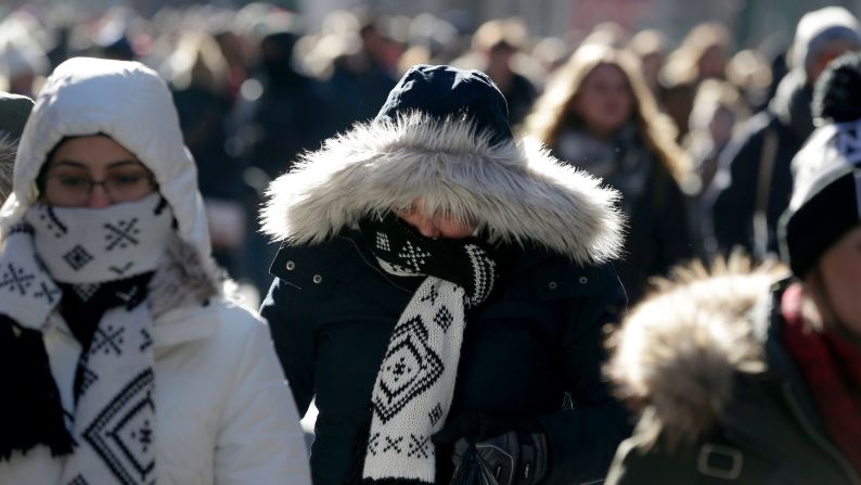 People try to keep warm in New York's Times Square on December 27.
