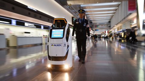 The security and guide robot "Reborg-X" produced by Japan's security company Alsok is demonstrated at a departure floor of Tokyo's Haneda Airprit on December 12, 2017. 
Japan Airport Terminal which manages Haneda Airport unveiled robots as part of the company's Haneda Airport robot experiment project to assist workers at the airport.   / AFP PHOTO / Kazuhiro NOGI        (Photo credit should read KAZUHIRO NOGI/AFP/Getty Images)
