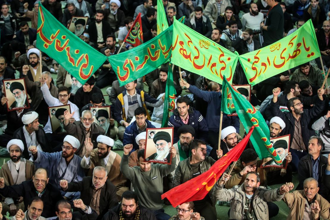 Iranians chant slogans as they march in support of the government in Tehran on Saturday.