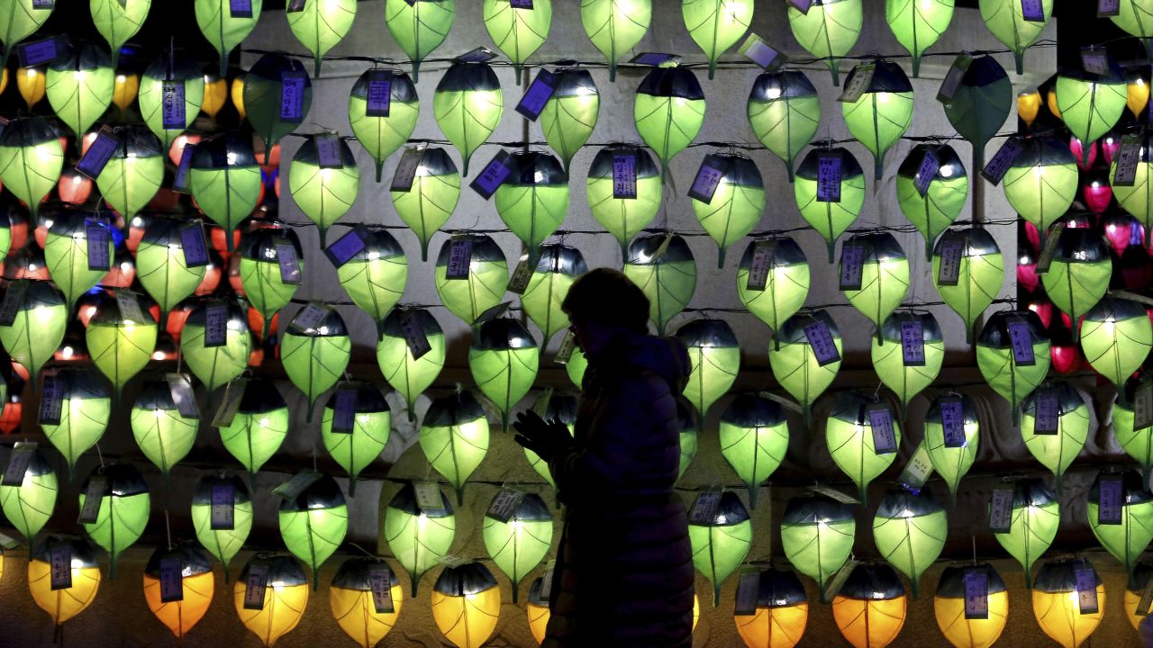 A woman prays in front of lanterns to celebrate the New Year at Jogyesa Buddhist temple in Seoul, South Korea.