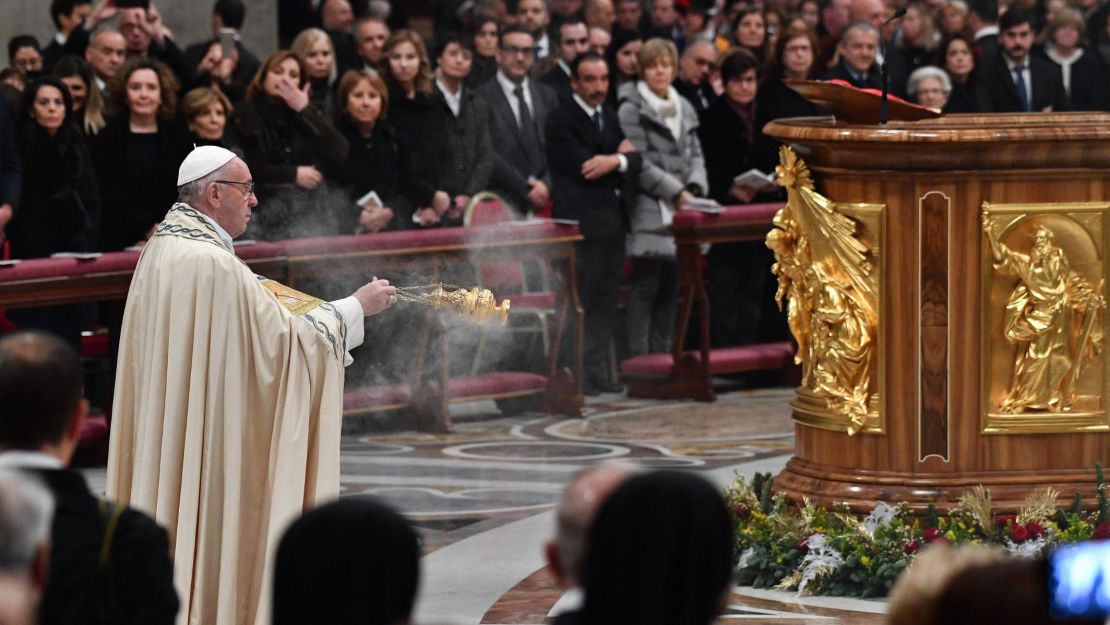 Pope Francis incenses the Christ Child during the Te Deum prayer in St Peter's Basilica at the Vatican on December 31, 2017. 