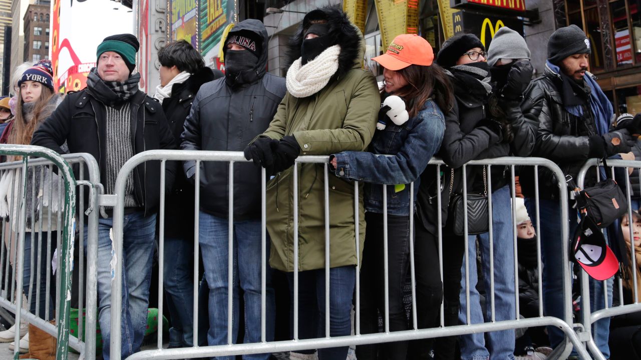 New Yorkers, celebrity entertainers and tourists from around the world packed into Times Square Sunday for what's expected to be a flashy but frigid celebration.