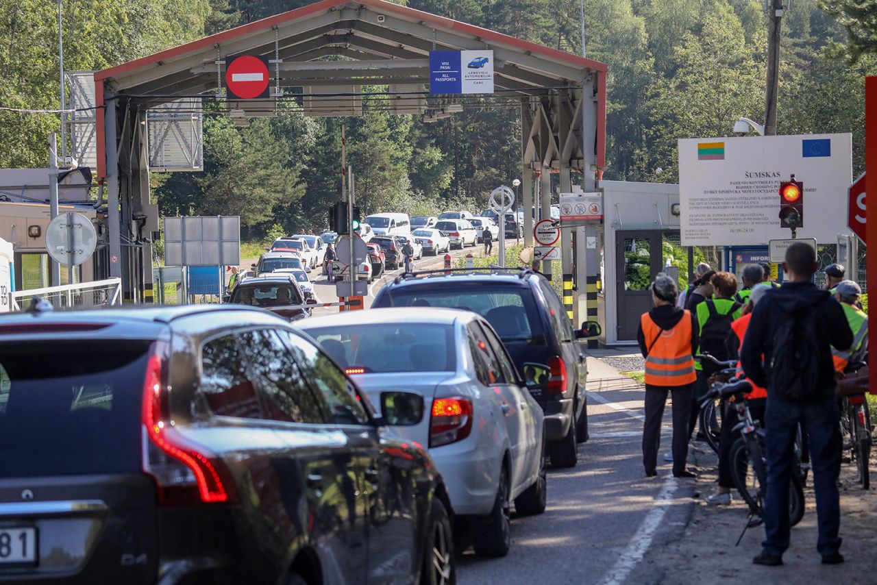 People wait at the Šumskas border crossing point between Lithuania and Belarus on August 12. 