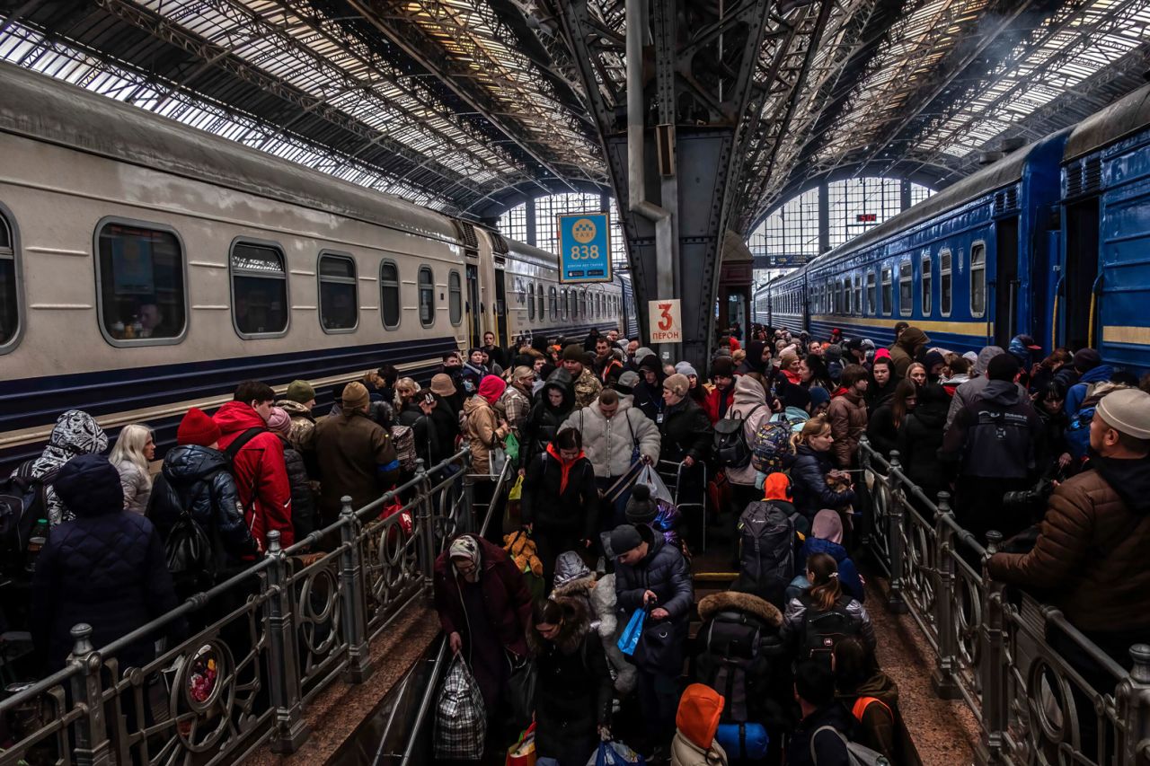 Refugees from Maiurpol arrive at the train station of Lviv meet with others going to take a train for Poland on May 19.