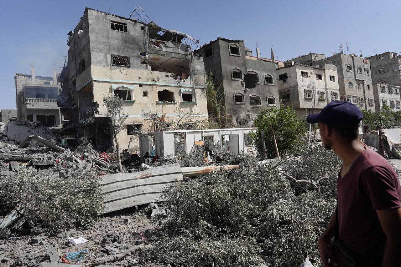 A Palestinian inspects the debris to buildings following an operation by the Israeli Special Forces in the Nuseirat camp on June 8.
